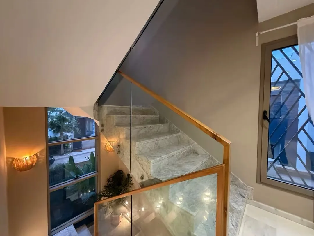 Marble staircase, glass banister