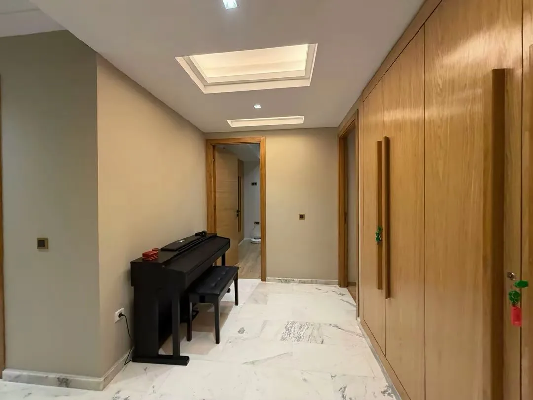 Landing with piano and large cupboards