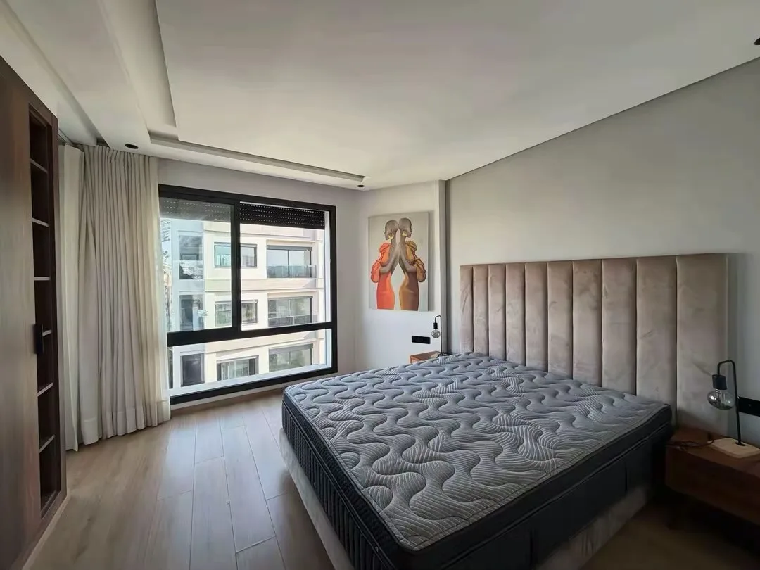 Second suite, with a padded headboard and large window